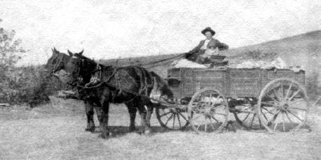 Hadley Bean & Blanche in horse-drawn wagon leaving ranch